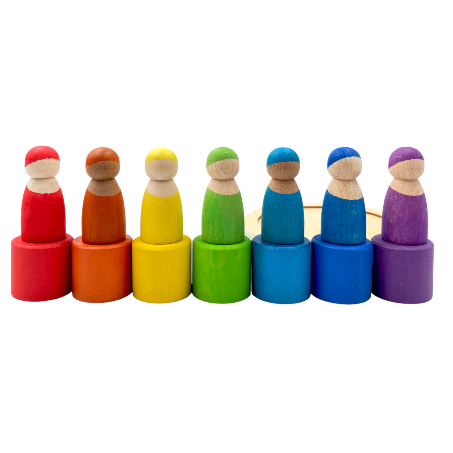 7 different skin stones stained rainbow wooden peg dolls in bowls