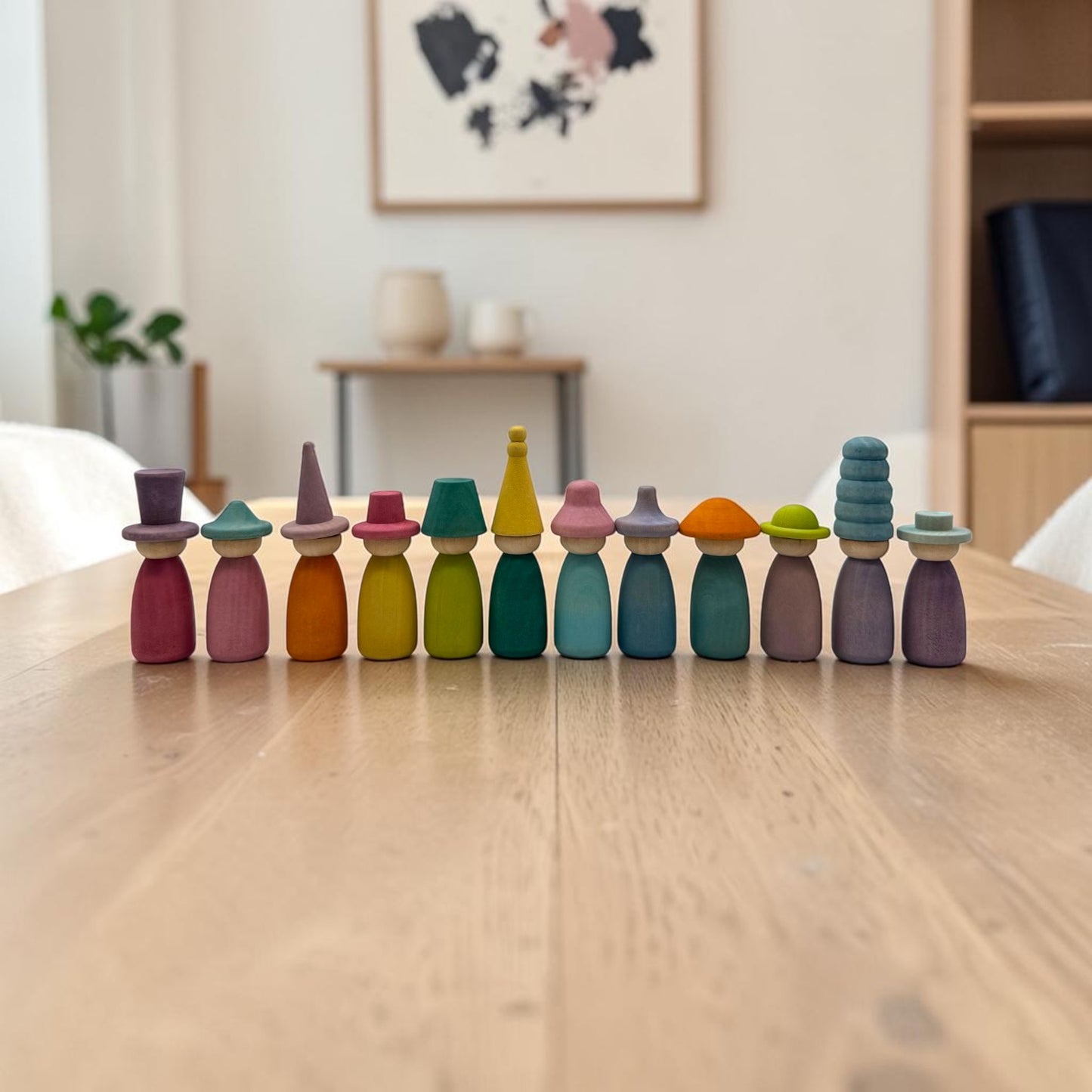 12 piece stained wooden peg dolls with interchangeable hats
