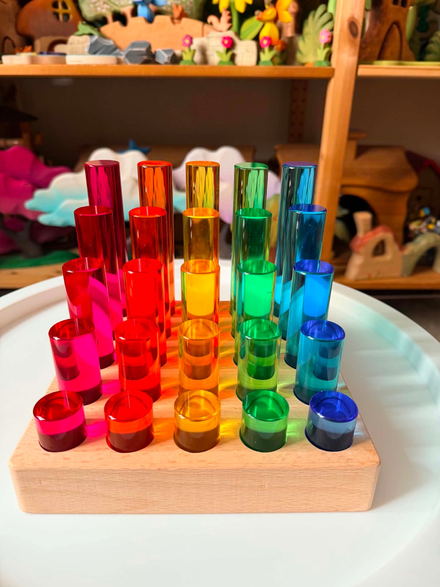 25-piece crystal clear rainbow acrylic cylinders with beech wood base