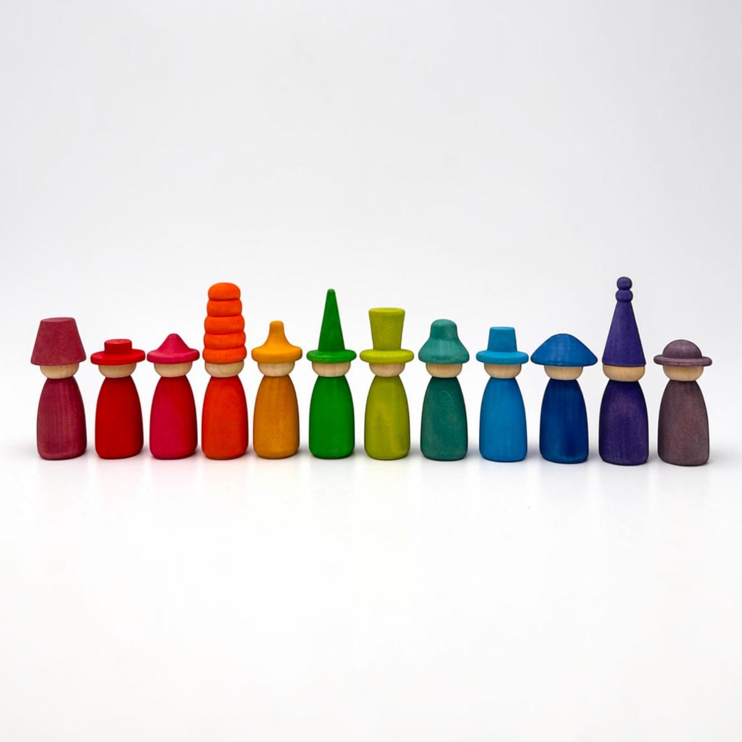 12 piece stained wooden peg dolls with interchangeable hats