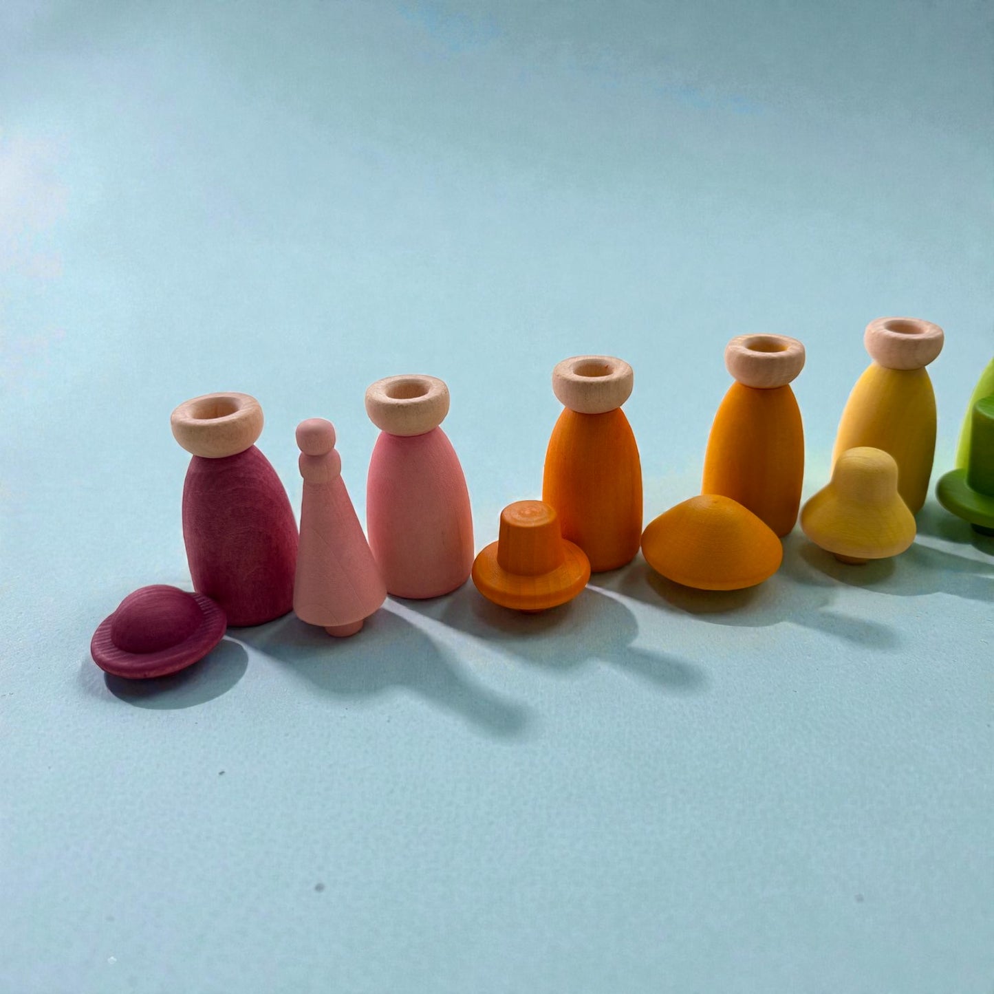 12 piece pastel macaron wooden peg dolls with interchangeable hats open ended play figures